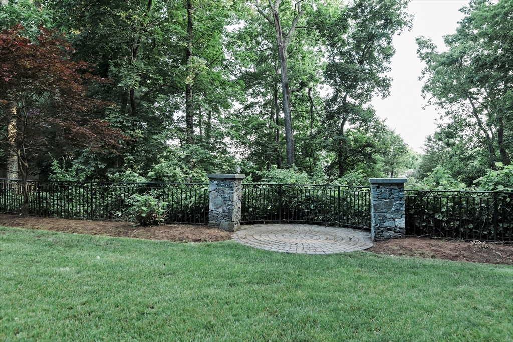 56 Sears Road Southborough, MA 01772 - Photo 26 of 26 a view of a backyard with potted plants and large trees