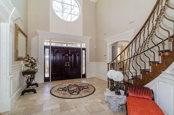 a view of a livingroom with furniture and front door