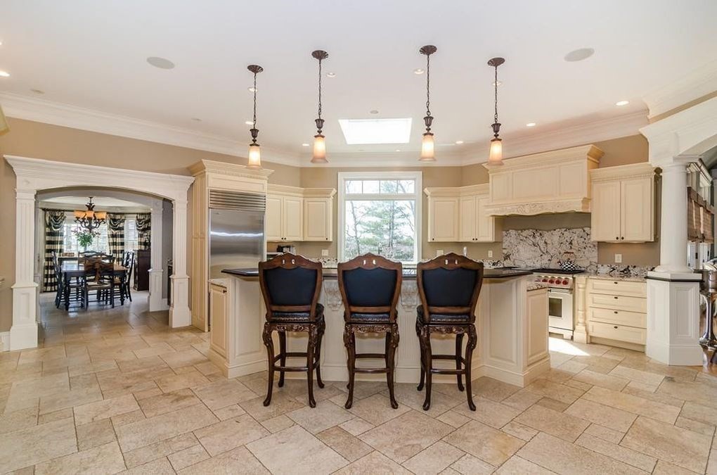 56 Sears Road Southborough, MA 01772 - Photo 4 of 26 a kitchen with lots of counter top space and stainless steel appliances
