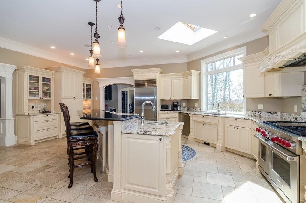 56 Sears Road Southborough, MA 01772 - Photo 5 of 26 a kitchen with cabinets and chairs