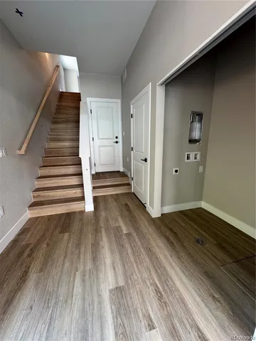 a view of entryway with wooden floor