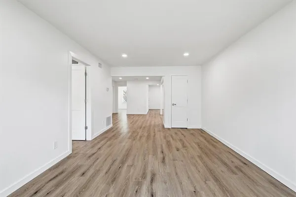 a view of wooden floor in an empty room