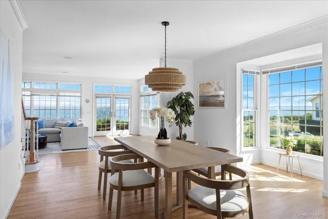 a dining room with furniture and wooden floor