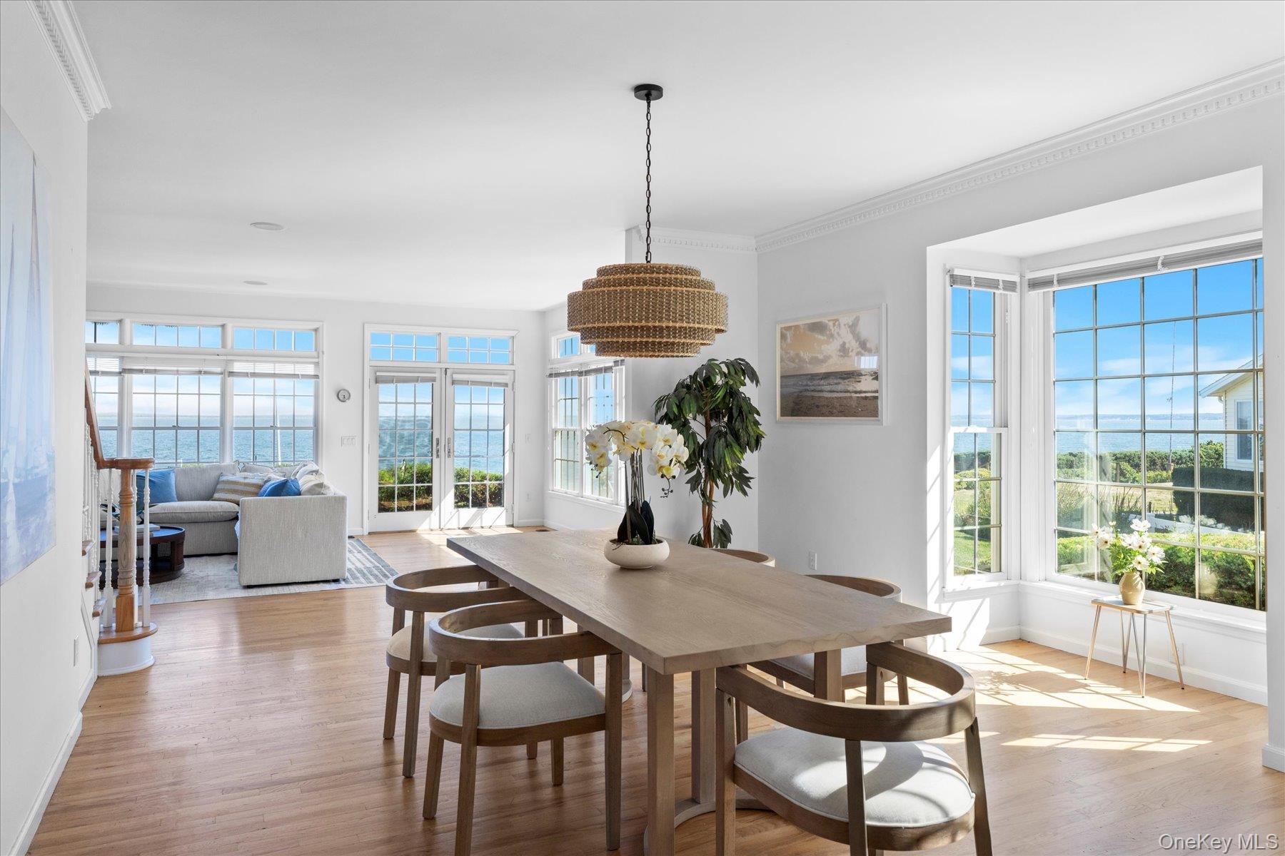 a dining room with furniture and wooden floor