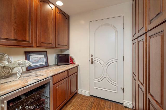 a bed room with a bed and a painting on the wall