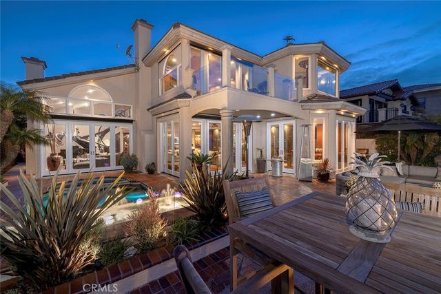 a view of swimming pool with seating area