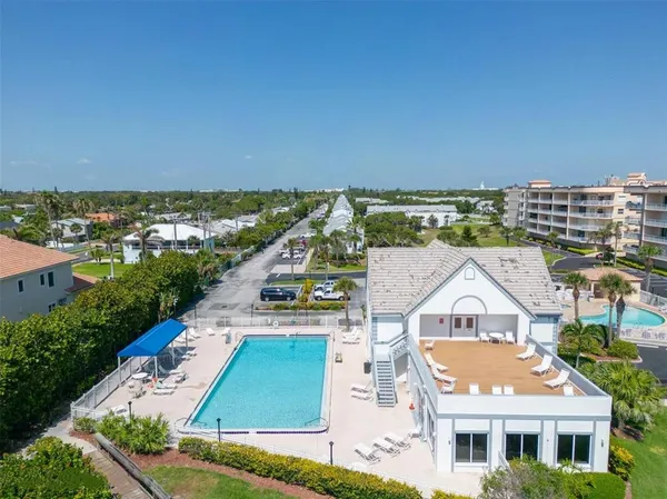 an aerial view of residential houses with outdoor space
