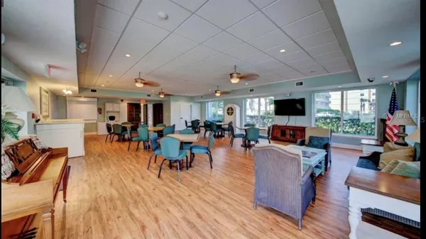 a view of swimming pool with outdoor seating