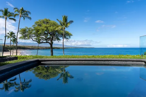 a view of swimming pool with a table and chairs