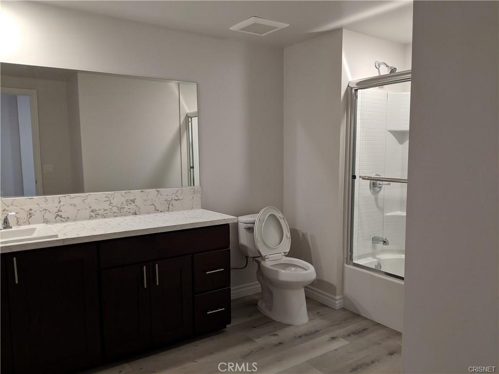 7343 Reseda Boulevard, Unit 303 Reseda, CA 91335 - Photo 4 of 10 a bathroom with a sink and a mirror