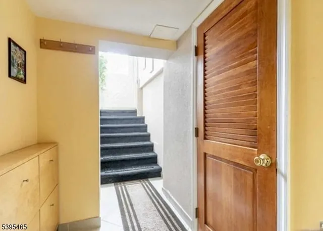 a view of a staircase and wooden floor