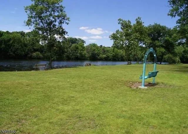 a view of a swimming pool with a yard