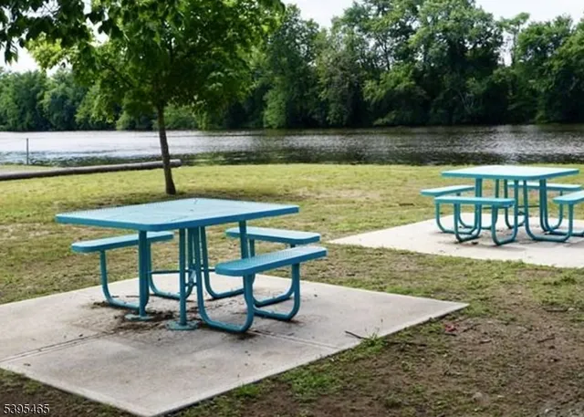 a view of a swimming pool with a table and chairs
