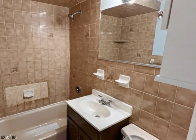 a bathroom with a sink mirror and shower