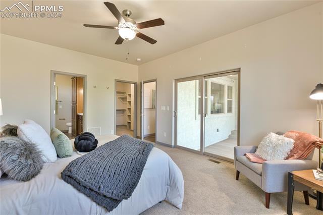 5126 Pring Ranch Road Colorado Springs, CO 80922 - Photo 14 of 32 Master bedroom with large walk-in closet, and lots of light.