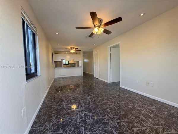 a view of a hallway with a chandelier