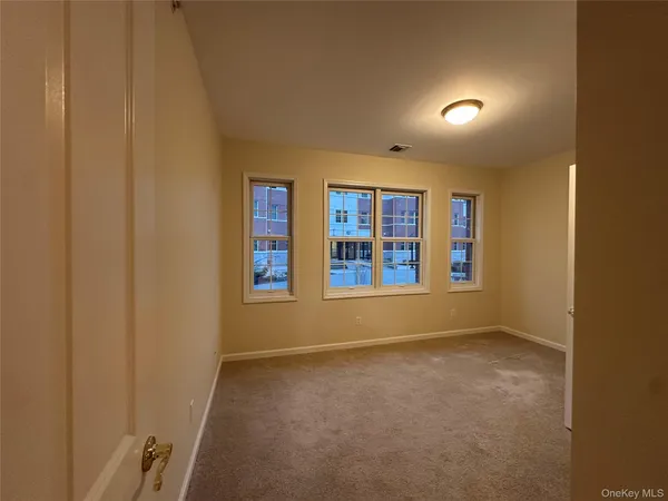 a kitchen with a refrigerator and cabinets