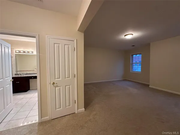 a bathroom with a granite countertop sink a mirror and a shower