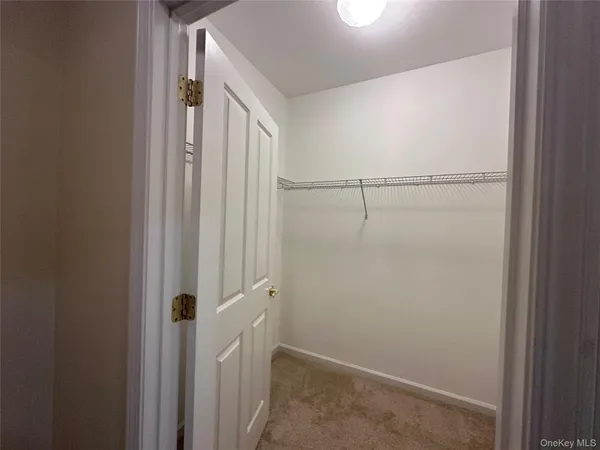 a view of a bathroom from the hallway