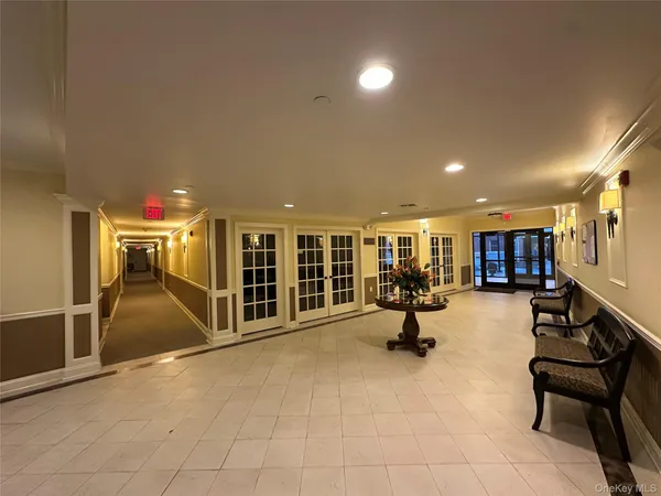 a living room with furniture and a piano