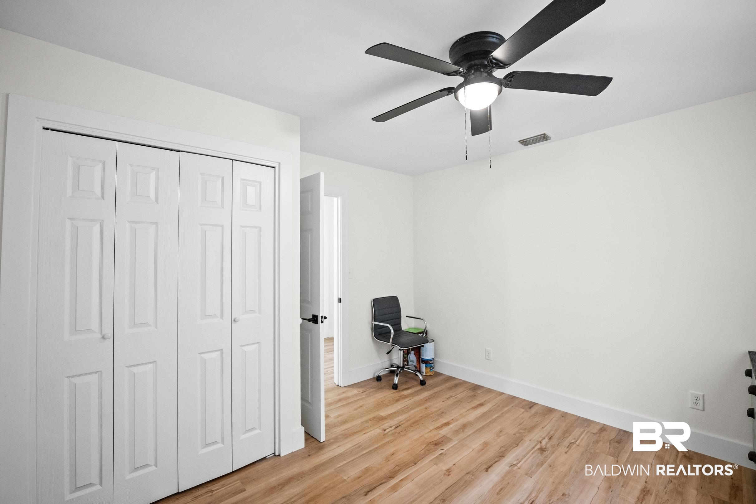 6 Wren Circle Foley, AL 36535 - Photo 29 of 55 Unfurnished bedroom featuring a ceiling fan, baseboards, visible vents, light wood-style flooring, and a closet