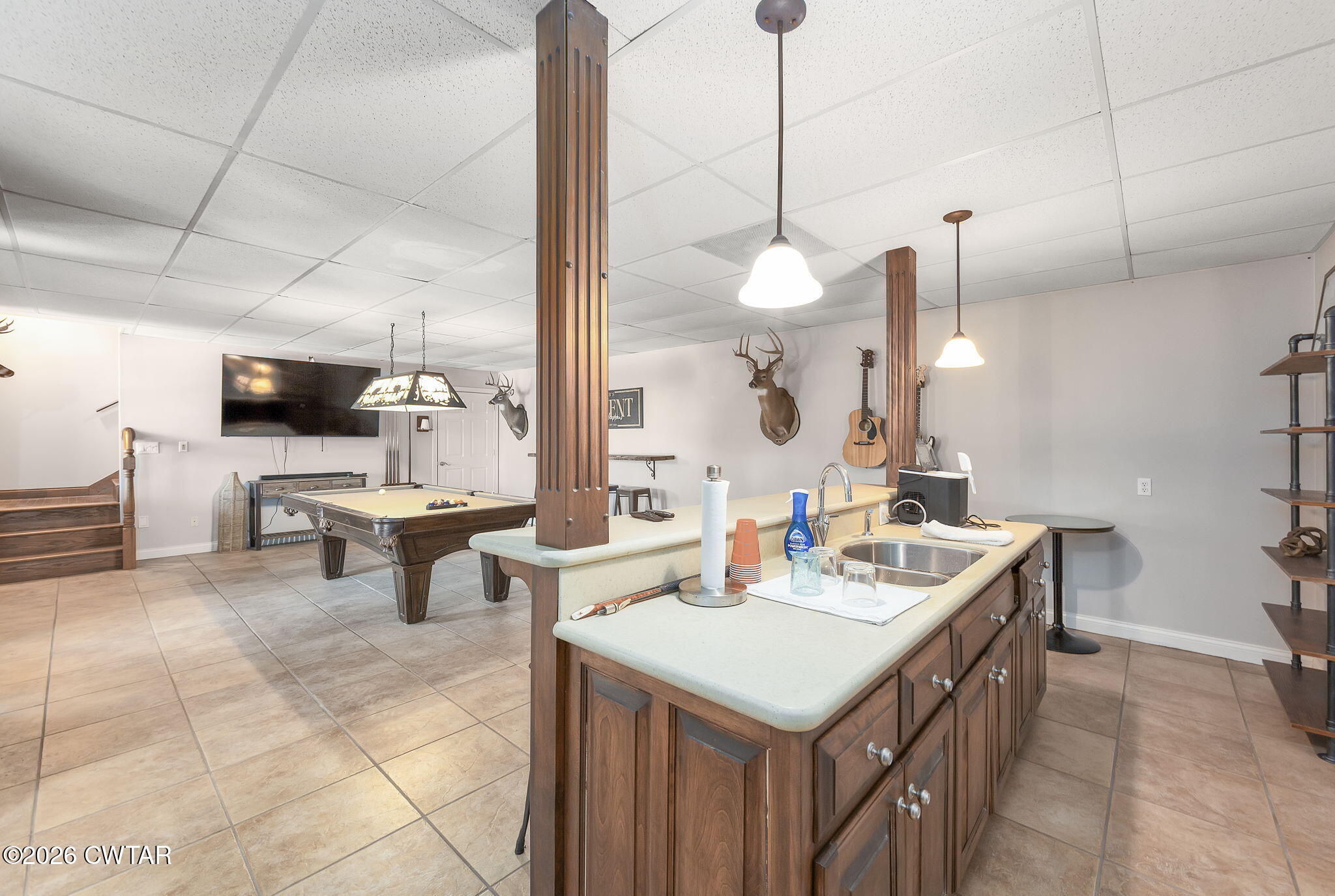 4320 Timberlake-Wildersville Road Lexington, TN 38351 - Photo 33 of 58 a kitchen with a sink a counter and chairs
