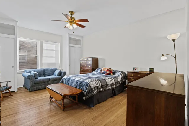 a bedroom with bed and window