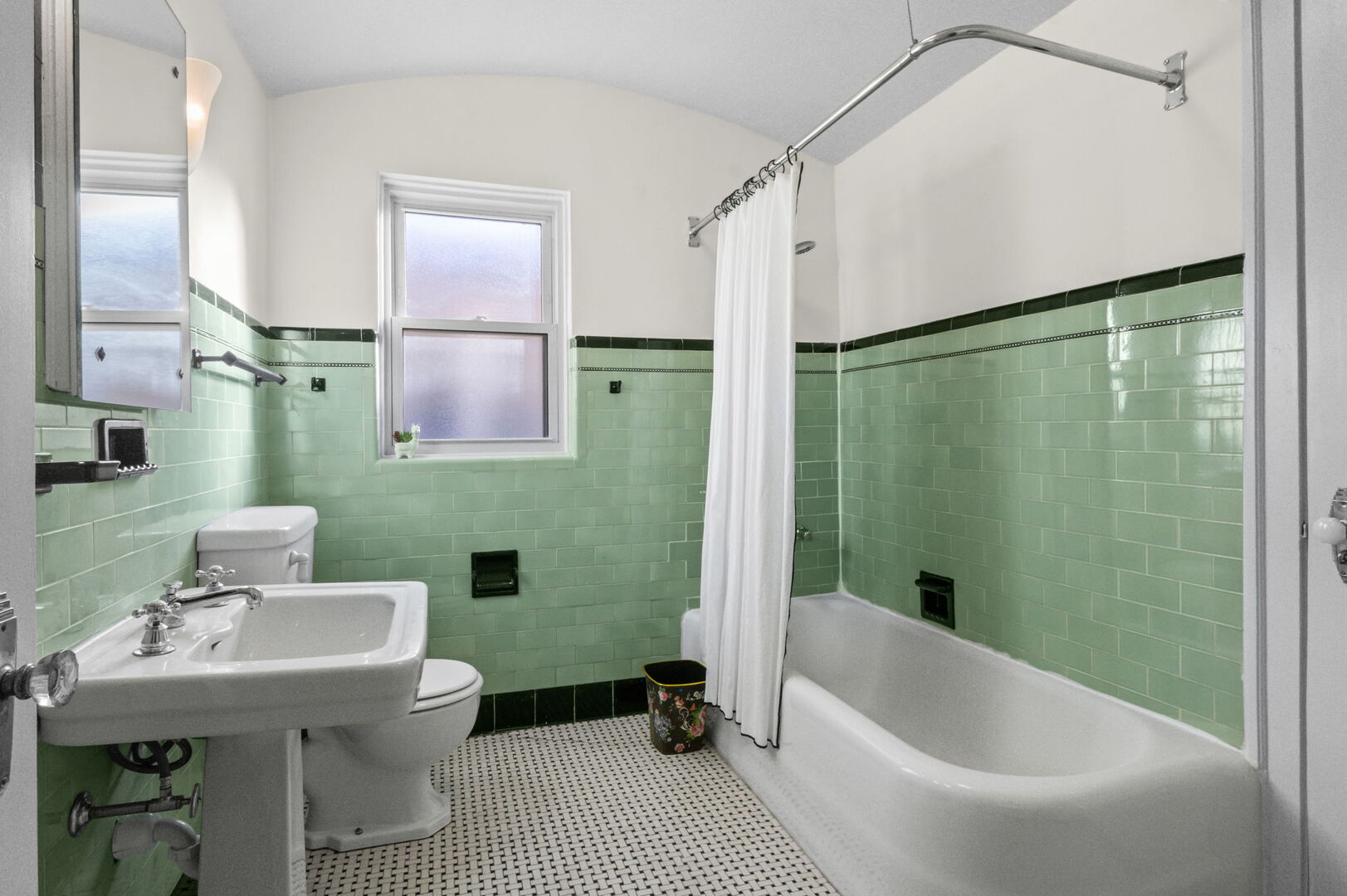 8037 Kenton Avenue, Unit 2S Skokie, IL 60076 - Photo 17 of 20 a bathroom with a sink a toilet and shower