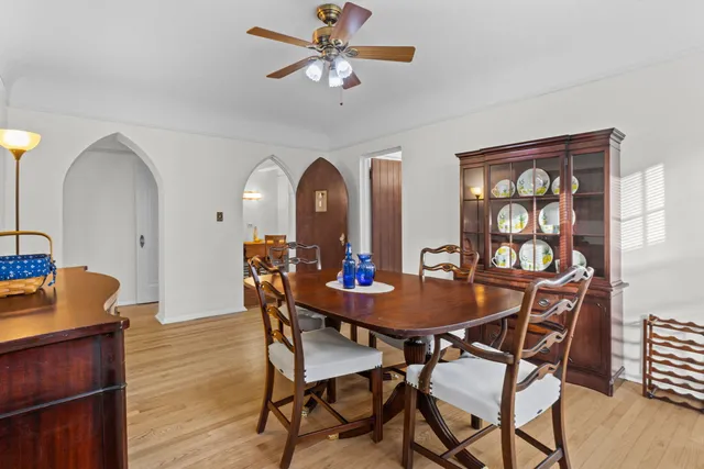 a dining room with furniture and window