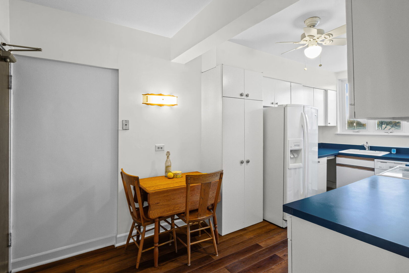 8037 Kenton Avenue, Unit 2S Skokie, IL 60076 - Photo 10 of 20 a view of a dining room with furniture and wooden floor