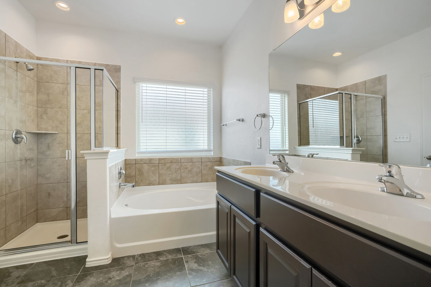 2420 Ranger Pass Seguin, TX 78155 - Photo 14 of 28 Bathroom featuring a dual vanity, large mirror, and tiled flooring