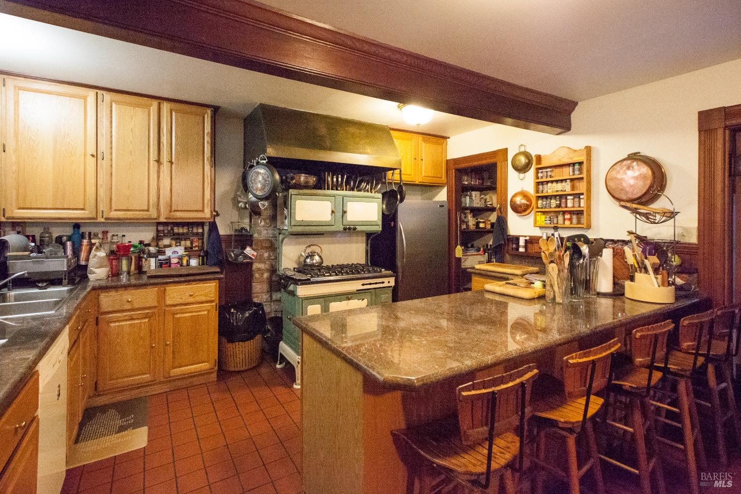 200 Rd To Ranch Nicasio, CA 94946 - Photo 7 of 37 a kitchen with stainless steel appliances granite countertop a sink a stove and refrigerator