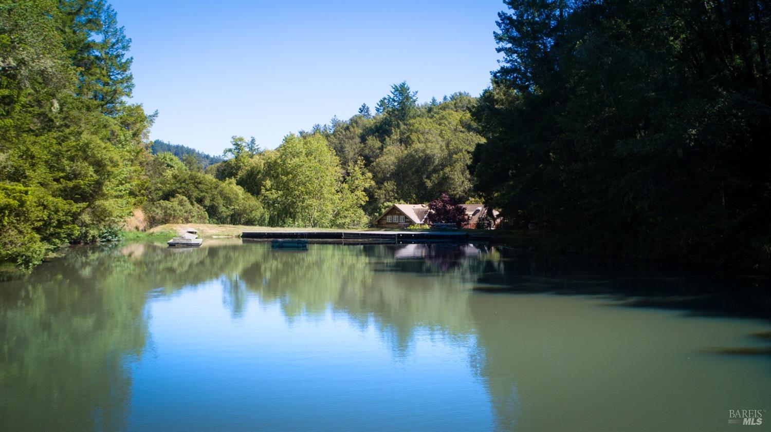 200 Rd To Ranch Nicasio, CA 94946 - Photo 10 of 37 a view of a lake with a house in the background