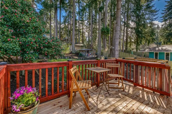 a view of a chairs on wooden deck