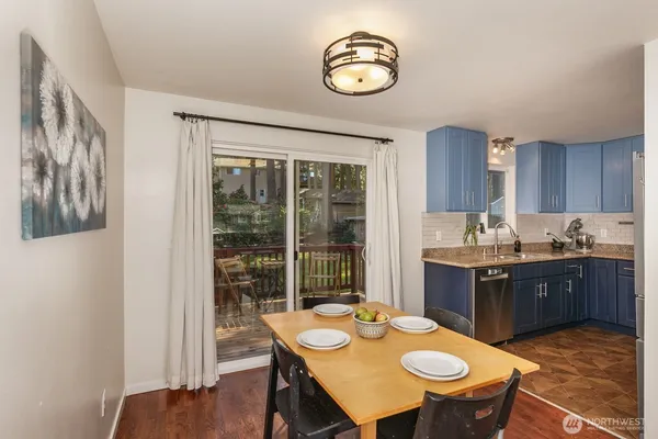a view of a dining room with furniture window and wooden floor