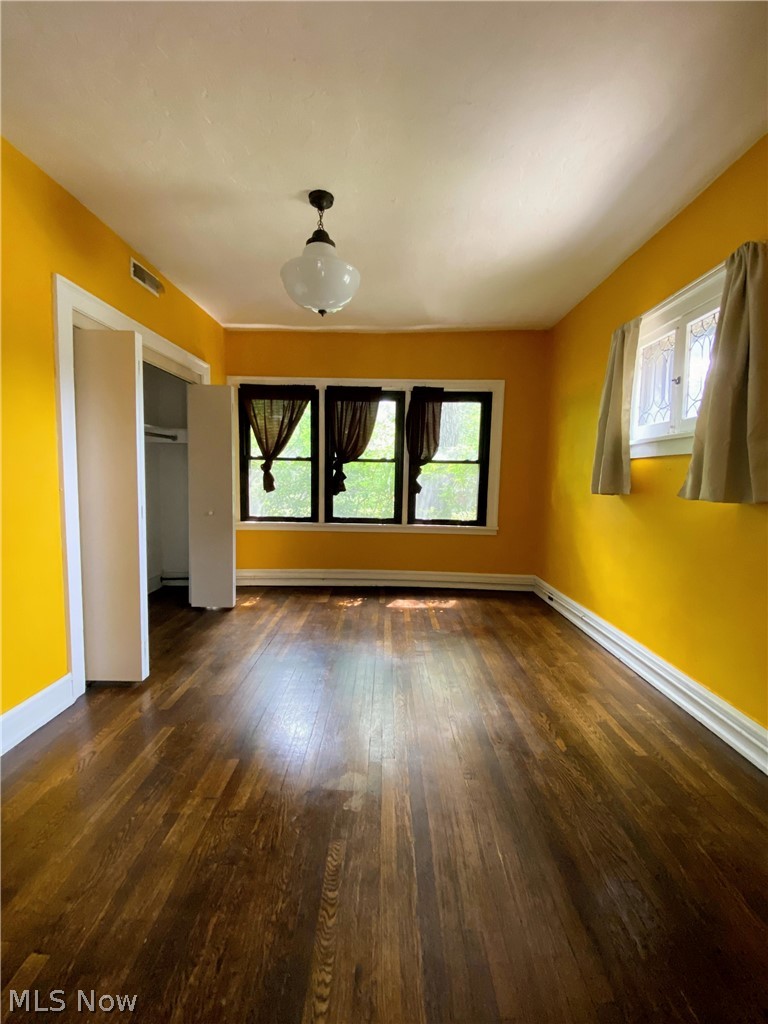 2469 Overlook Road, Unit 1 Cleveland Heights, OH 44106 - Photo 8 of 20 Off the kitchen is a dining room with hardwood floors.