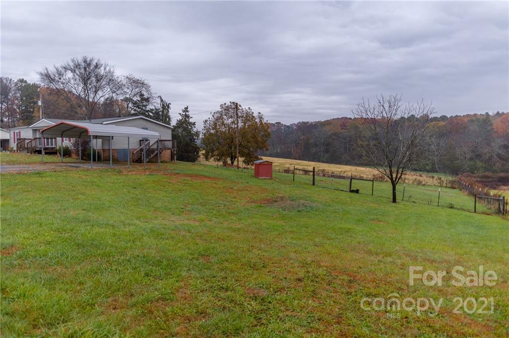 5432 Rushing Road Stanfield, NC 28163 - Photo 2 of 34 a view of outdoor space with garden and trees