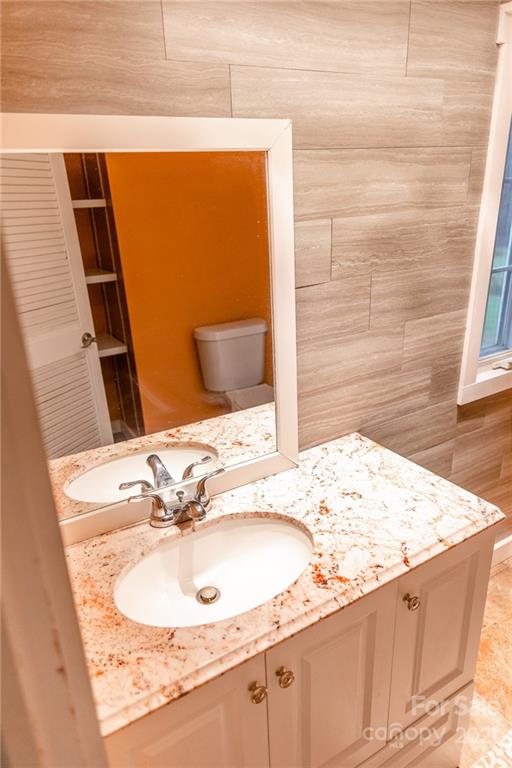 5432 Rushing Road Stanfield, NC 28163 - Photo 11 of 34 a bathroom with a sink and a mirror
