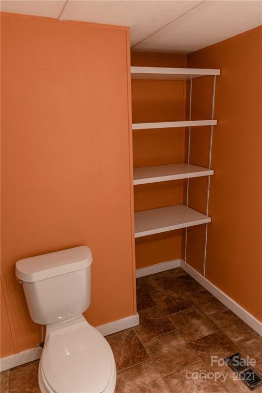 5432 Rushing Road Stanfield, NC 28163 - Photo 12 of 34 a bathroom with a toilet