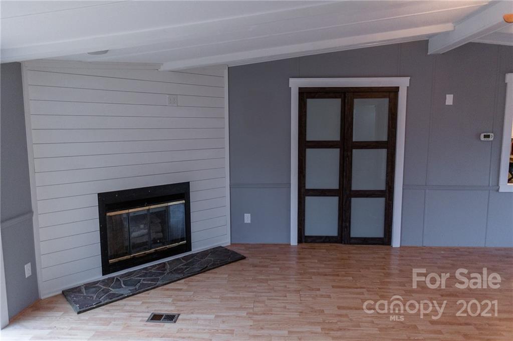 5432 Rushing Road Stanfield, NC 28163 - Photo 13 of 34 a view of empty room with a fireplace