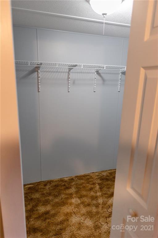 5432 Rushing Road Stanfield, NC 28163 - Photo 21 of 34 a view of a room with racks on the wall