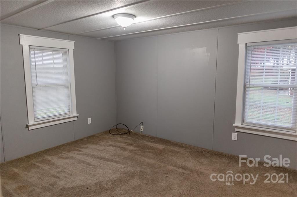 5432 Rushing Road Stanfield, NC 28163 - Photo 22 of 34 an empty room with windows