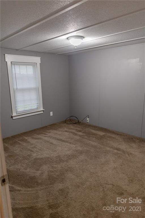 5432 Rushing Road Stanfield, NC 28163 - Photo 23 of 34 a view of an empty room with a window