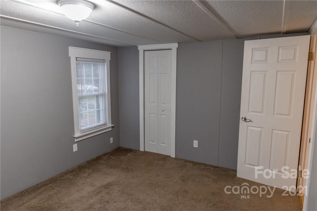 5432 Rushing Road Stanfield, NC 28163 - Photo 24 of 34 a view of an empty room with a window