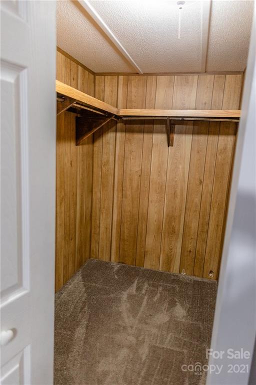 5432 Rushing Road Stanfield, NC 28163 - Photo 25 of 34 a view of walk in closet with clothes
