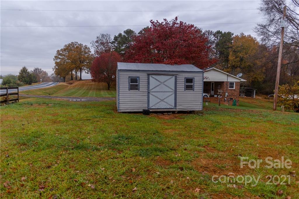 5432 Rushing Road Stanfield, NC 28163 - Photo 4 of 34 a view of a house with a yard