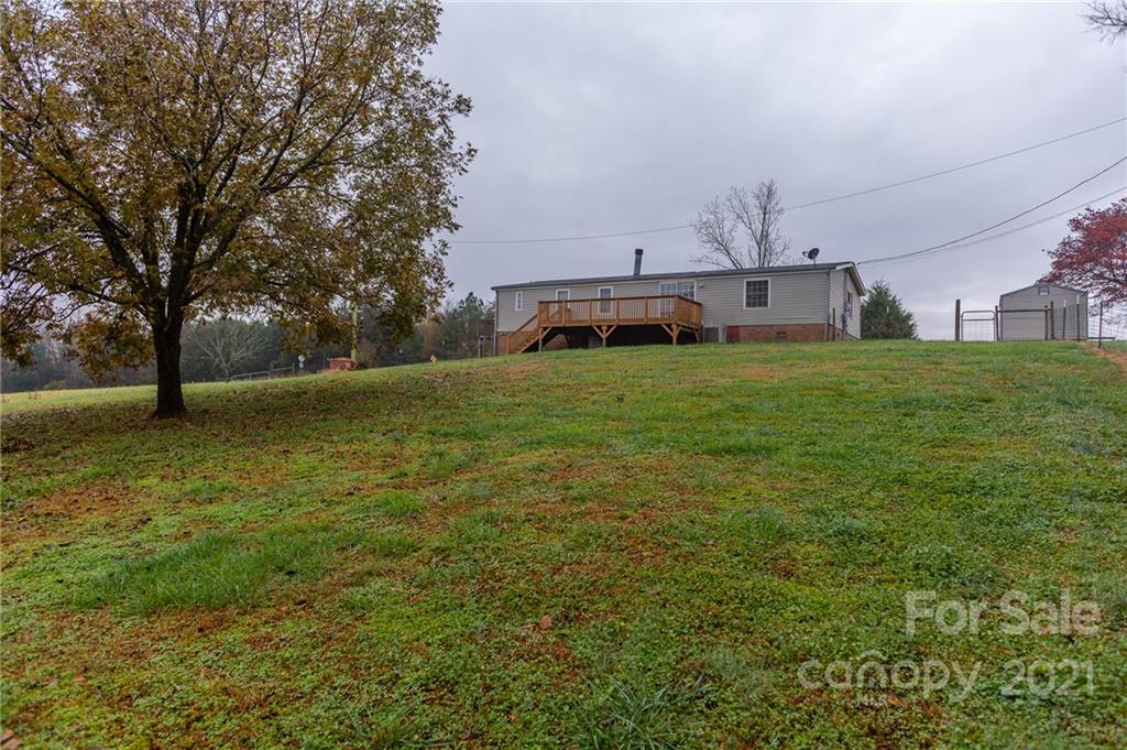 5432 Rushing Road Stanfield, NC 28163 - Photo 33 of 34 a view of a house with a big yard