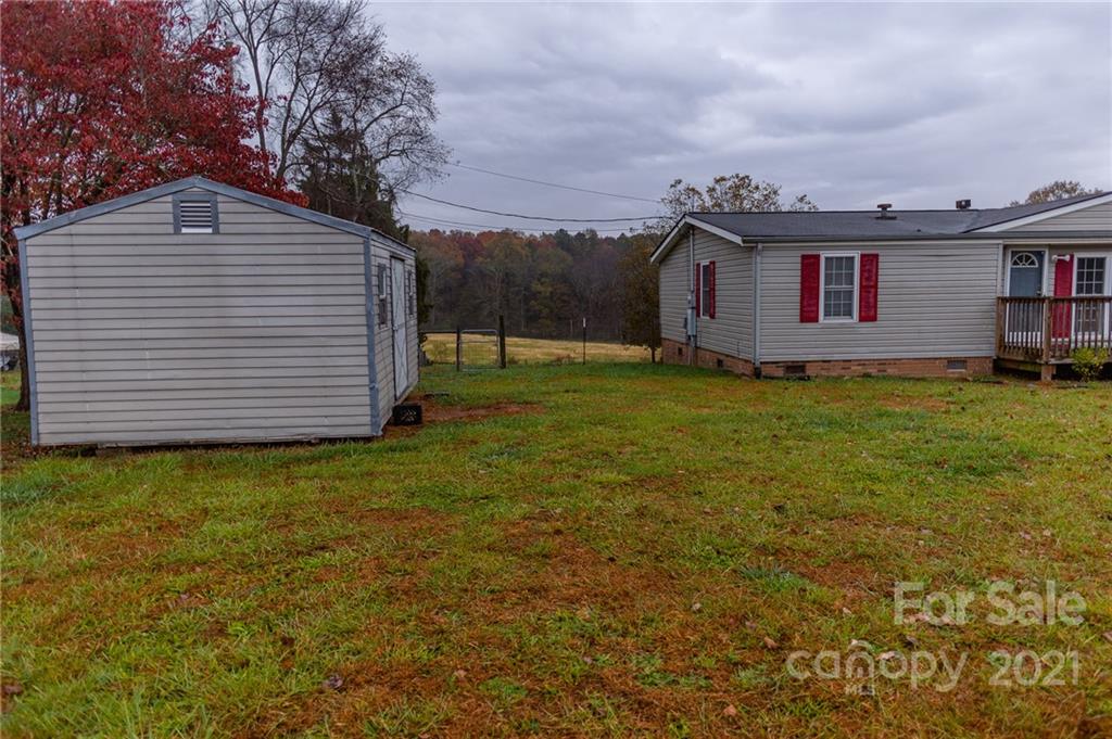 5432 Rushing Road Stanfield, NC 28163 - Photo 5 of 34 a view of a house with a yard