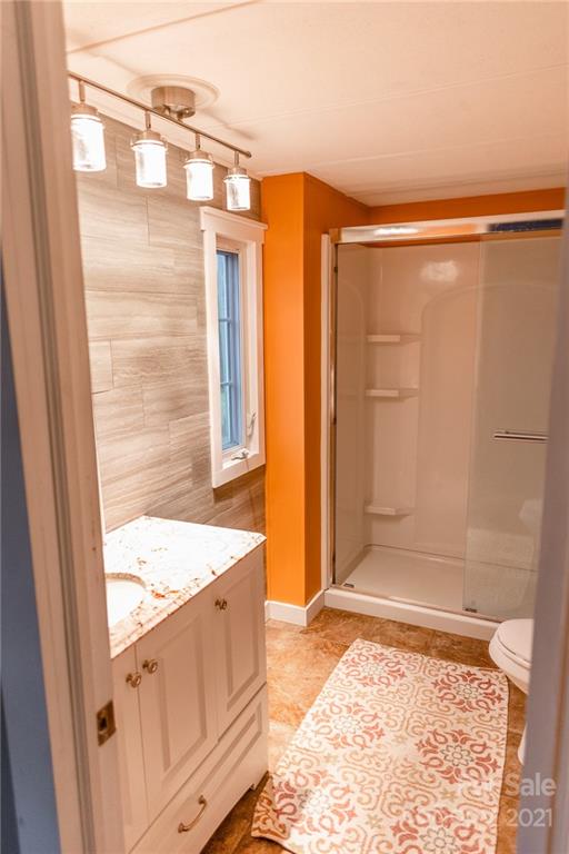 5432 Rushing Road Stanfield, NC 28163 - Photo 10 of 34 a bathroom with a tub and shower