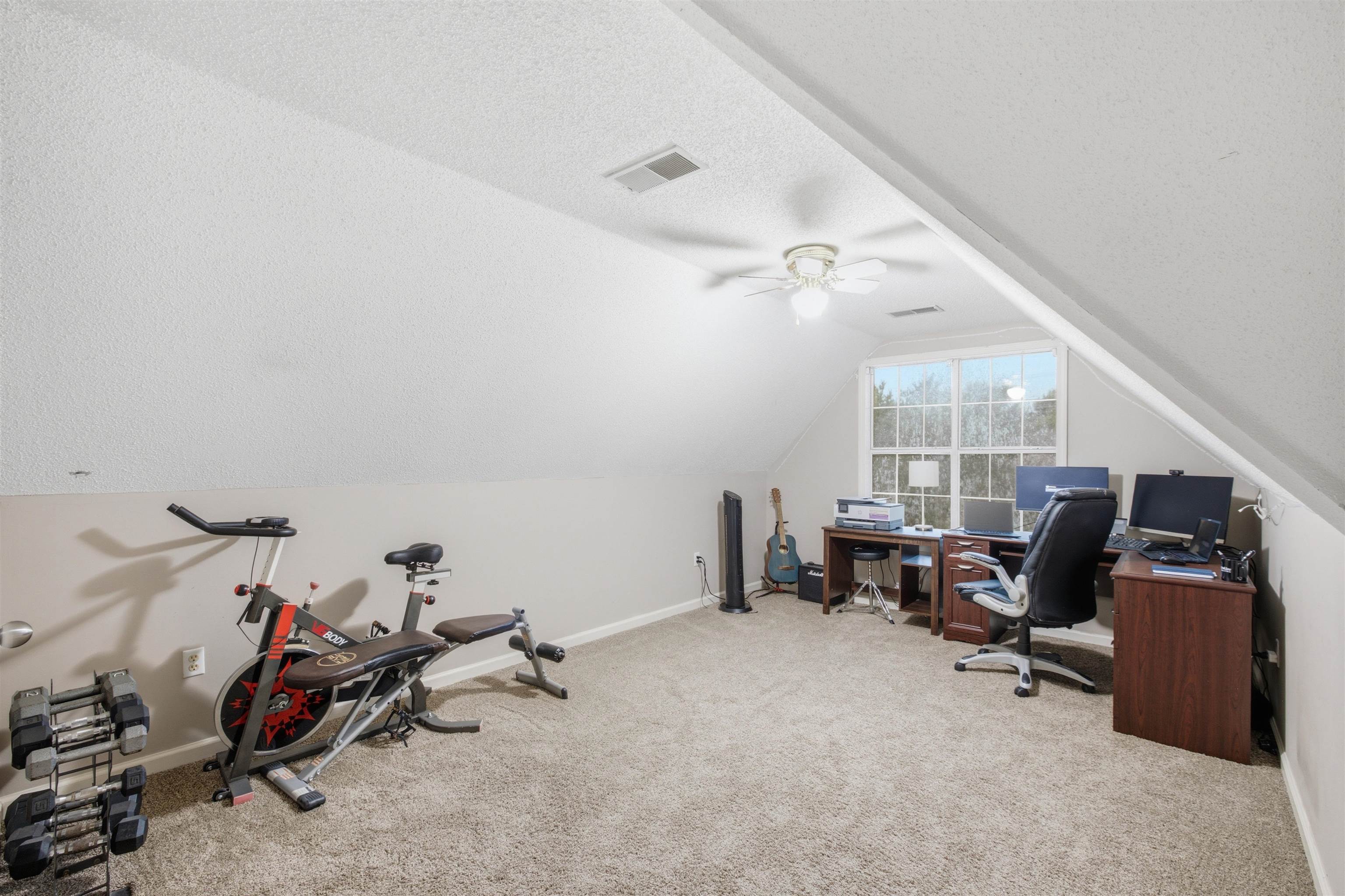 96 Berryfield Cove Collierville, TN 38017 - Photo 28 of 39 Spacious bonus room featuring sloped ceilings, light gray wall paint, and neutral carpeting